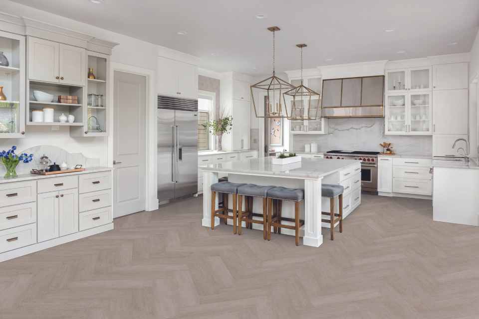 grey washed luxury vinyl herringbone in white modern kitchen